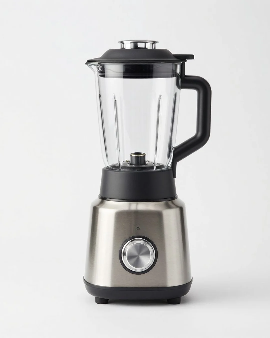 Stainless-steel blender on plain backdrop